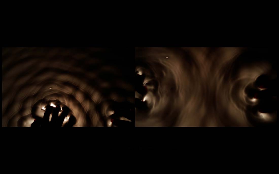 Screening of a film by Anna and Maria von Hausswolff for the BFI Sonic Cinema event Lachrimae. Abstract image with vaguely visible a close-up of two hands reaching into a circle of light