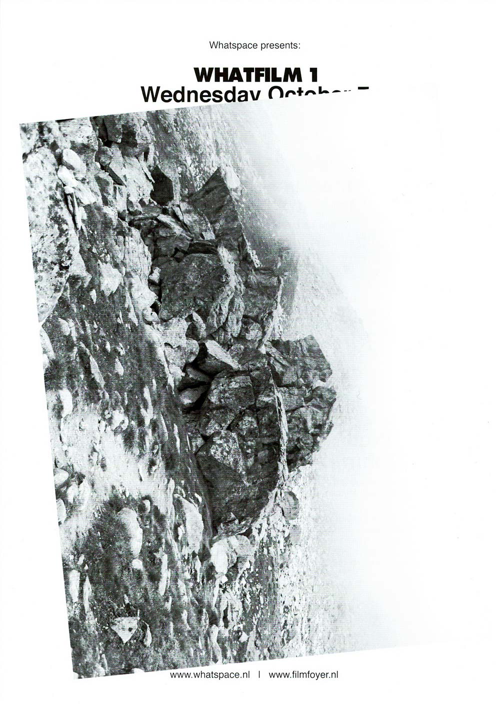 Front of the Whatfilm flyer showing a black and white photograph of a snowy rocky mountainous landscape